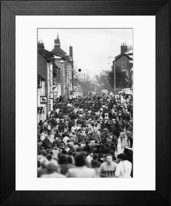 Framed Print : Thousands of villagers line the streets of Atherstone for the traditional Shrove Tuesday Framed Print : Thousands of villagers line the streets of Atherstone for the traditional Shrove Tuesday