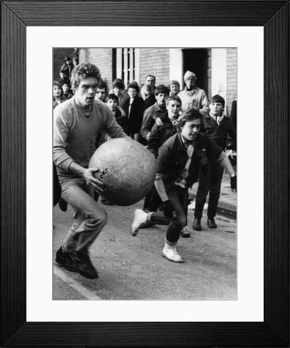 Framed Print : Thousands of villagers line the streets of Atherstone for the traditional Shrove Tuesday