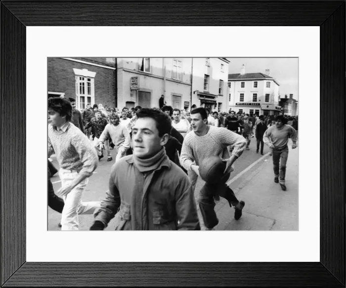 Framed Print : Thousands of villagers line the streets of Atherstone for the traditional Shrove Tuesday Framed Print : Thousands of villagers line the streets of Atherstone for the traditional Shrove Tuesday