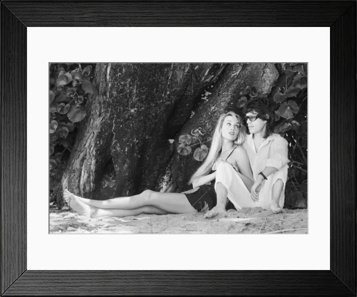 Framed Print : Mick Jagger and Jerry Hall seen here taking a stroll along the beach at Gibbs Bay in Framed Print : Mick Jagger and Jerry Hall seen here taking a stroll along the beach at Gibbs Bay in