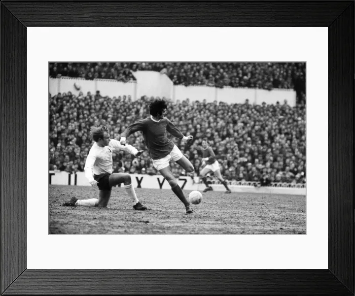 Framed Print : George Best of Manchester United back heels the ball to a team mate as Phil Beal of Framed Print : George Best of Manchester United back heels the ball to a team mate as Phil Beal of