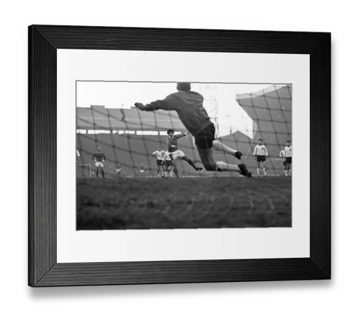 Framed Print : Manchester United footballer George Best scores his side Framed Print : Manchester United footballer George Best scores his side
