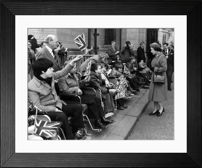 Framed Print : The Queen visits Manchester, 5th May 1982. Disabled youngsters provide a patriotic Framed Print : The Queen visits Manchester, 5th May 1982. Disabled youngsters provide a patriotic