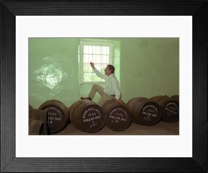 Framed Print : Dallas Dhu Historic Distillery Speyside, male sitting on barrel holding glass of whisky Framed Print : Dallas Dhu Historic Distillery Speyside, male sitting on barrel holding glass of whisky