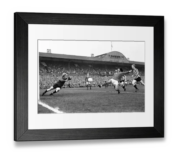 Framed Print : Manchester United footballer George Best in action against Newcastle United during