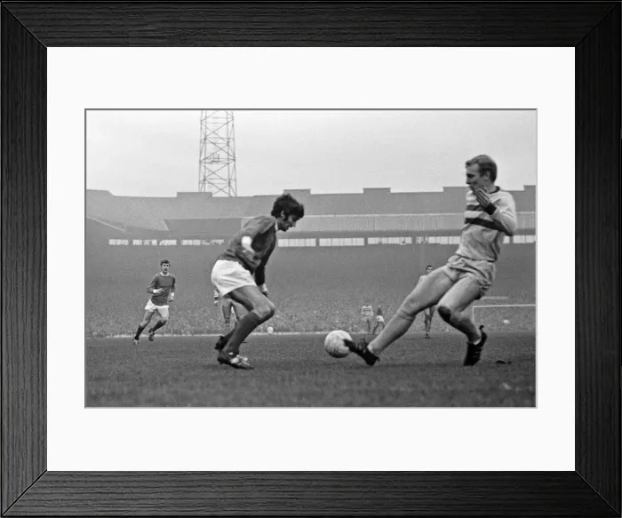 Framed Print : Manchester United footballer George Best faced by Bobby Moore of West Ham during