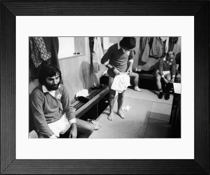 Framed Print : Former Manchester United footballer George Best in reflective mood as he puts Framed Print : Former Manchester United footballer George Best in reflective mood as he puts