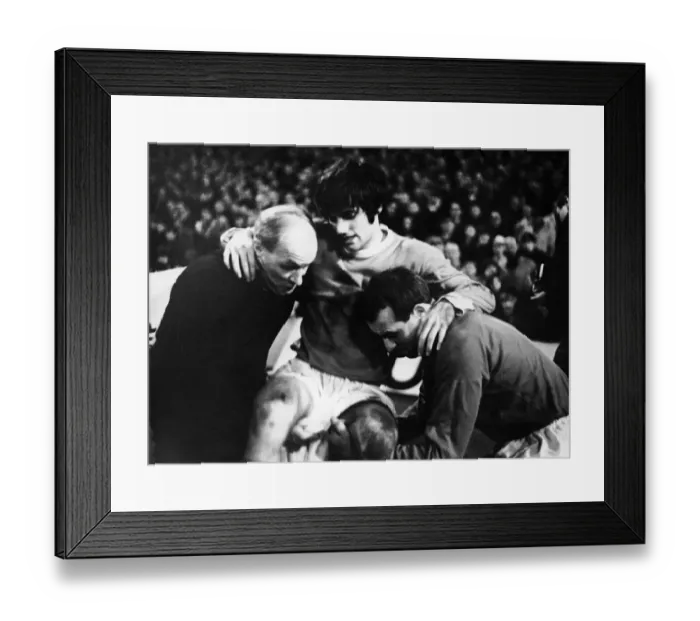 Framed Print : Manchester United footballer George Best is helped off the pitch by trainer Jack Framed Print : Manchester United footballer George Best is helped off the pitch by trainer Jack