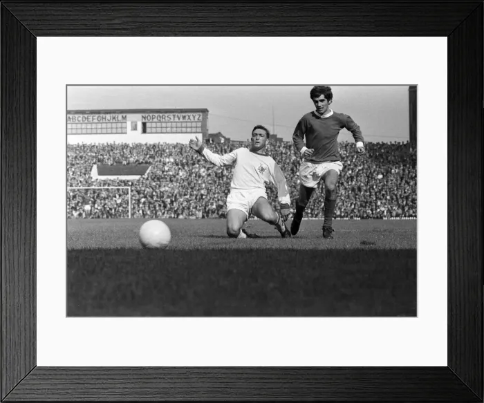 Framed Print : Manchester United footballer George Best in action against Nottingham Forest during Framed Print : Manchester United footballer George Best in action against Nottingham Forest during