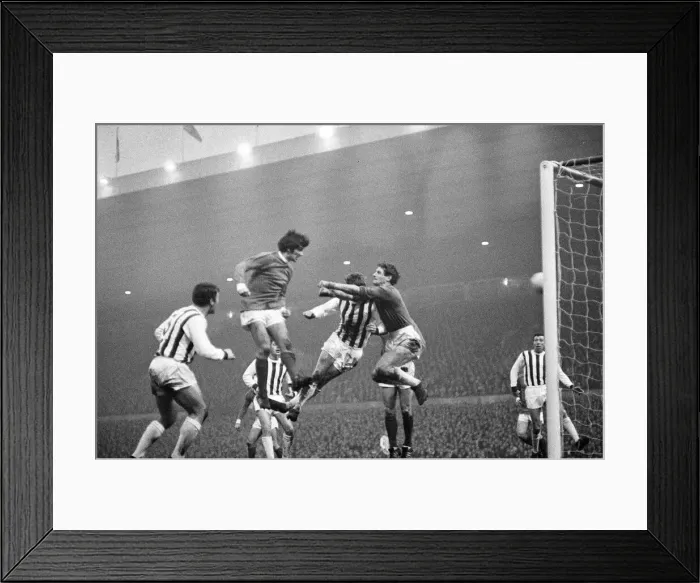 Framed Print : Manchester United footballer George Best in action to score his second goal with a header Framed Print : Manchester United footballer George Best in action to score his second goal with a header