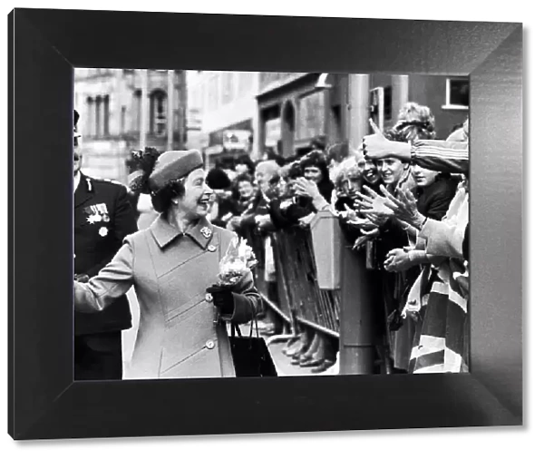 The Queen visits Manchester. The Queen laughs as she is greeted by the crowd