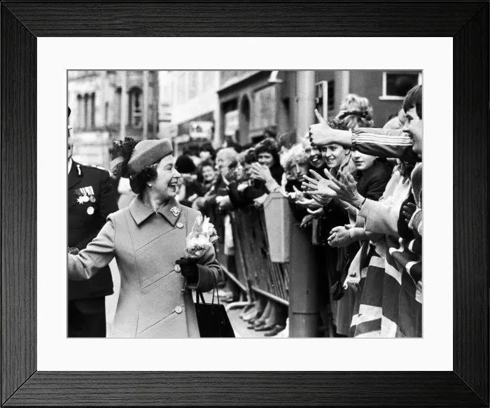 Framed Print : The Queen visits Manchester. The Queen laughs as she is greeted by the crowd Framed Print : The Queen visits Manchester. The Queen laughs as she is greeted by the crowd