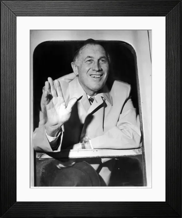Framed Print : Manchester City Manager Joe Mercer waves to well wishers as the teams train pulls out of Framed Print : Manchester City Manager Joe Mercer waves to well wishers as the teams train pulls out of