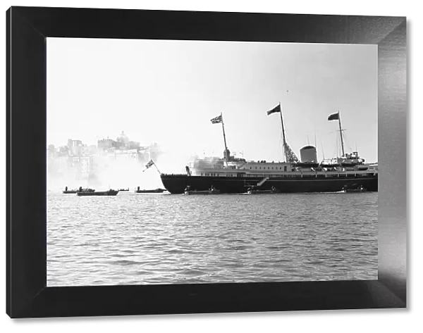 The Royal Yacht Britannia seen here arriving off Valletta Malta with Queen Elizabeth II