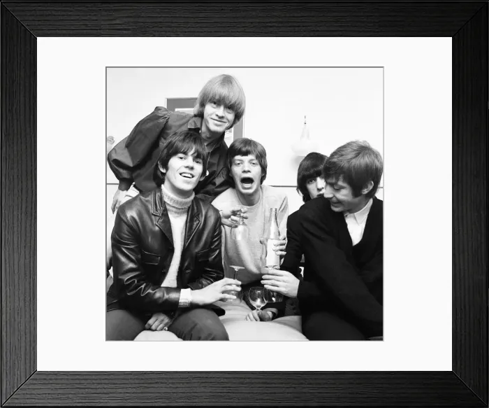 Framed Print : Rolling Stones celebrate in their Manchester hotel after hearing news that their latest Framed Print : Rolling Stones celebrate in their Manchester hotel after hearing news that their latest