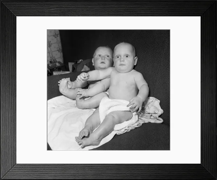 Framed Print : Twins Ian and Robert Kearns who both weighed eight pounds two ounces when they were born