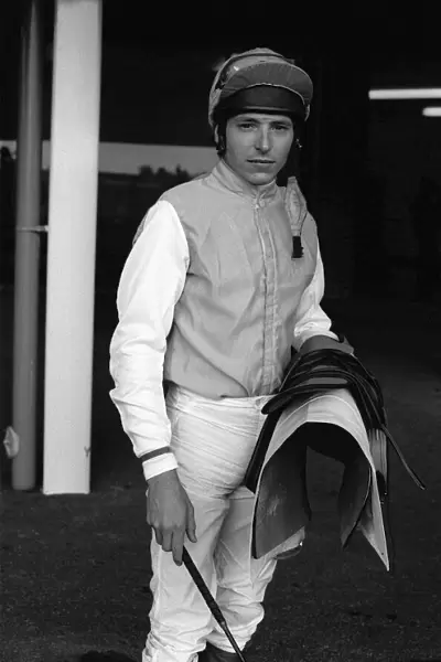 American jockey Steve Cauthen carrying his saddle and whip at Kempton Park, July 1987