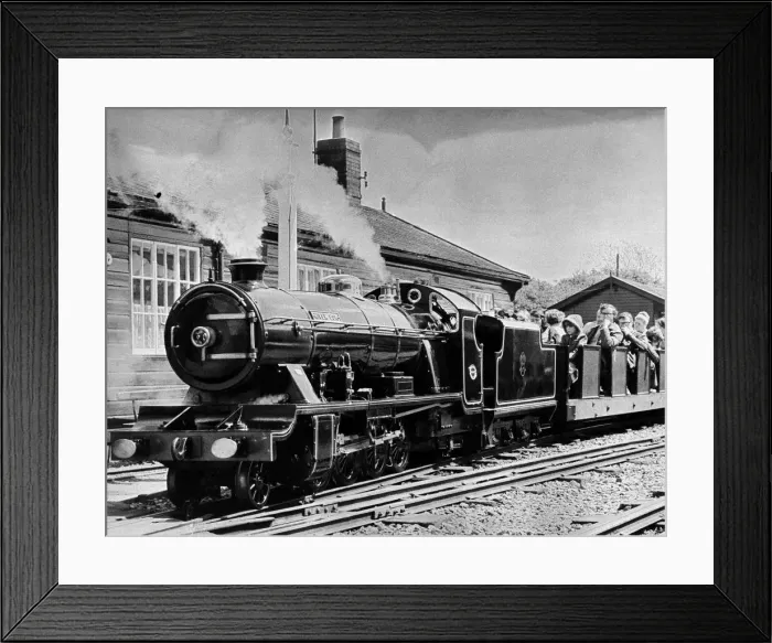 Framed Print : Passengers ride on the miniature engine and carriages on the Ravenglass