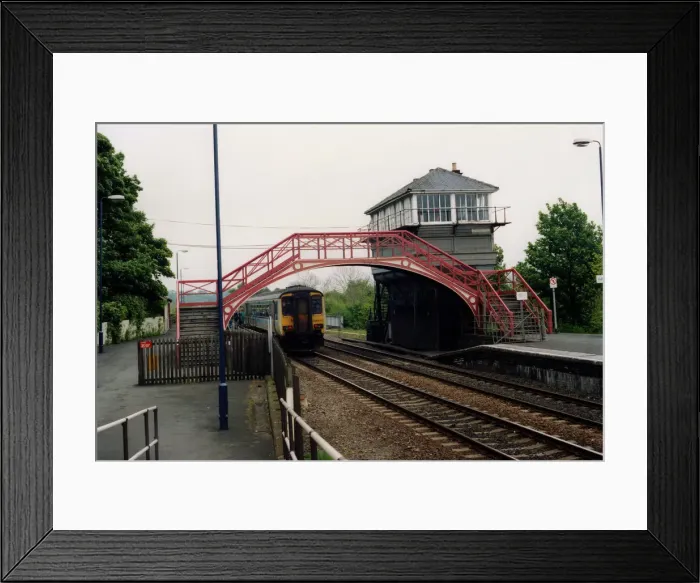 Framed Print : A general view of the signal box and footbridge at Haltwhistle Station on 31st May, 1994 Framed Print : A general view of the signal box and footbridge at Haltwhistle Station on 31st May, 1994