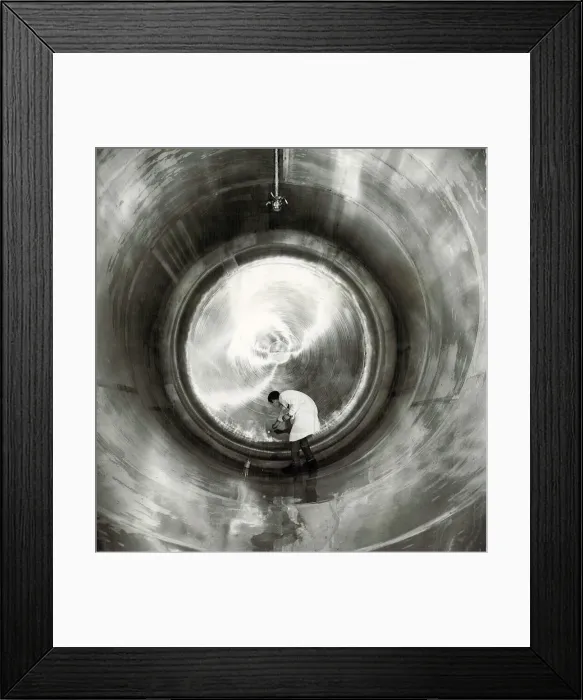 Framed Print : Ansells Brewery. A technician carrying out routine surface examination inside one