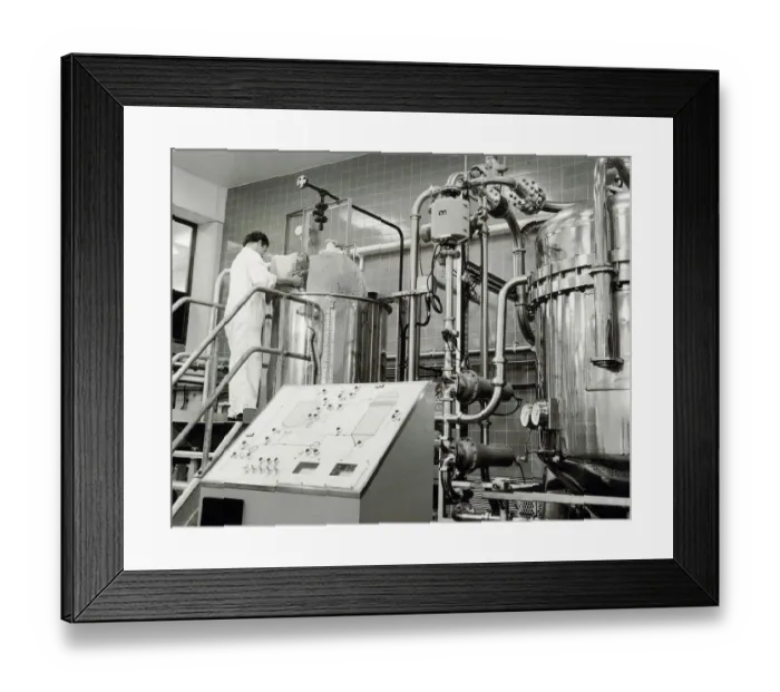 Framed Print : Ansells Brewery. A process operative adding a filtering agernt into the automatic