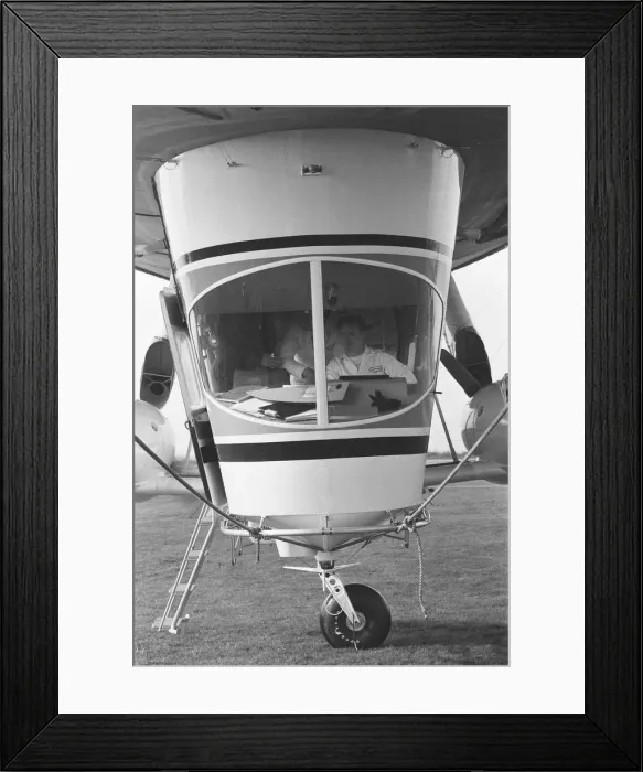 Framed Print : The pilot at the controls of Goodyear airship Europa seen here moored outside the giant