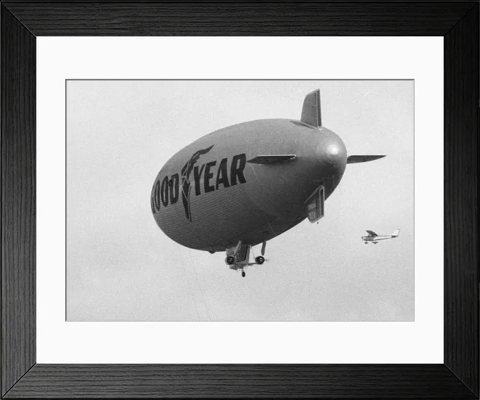 Framed Print : The Goodyear airship Europa seen escorted by a Cessna 172 light aircraft during proving Framed Print : The Goodyear airship Europa seen escorted by a Cessna 172 light aircraft during proving