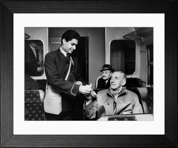 Framed Print : Mr. Anthony Ghafoor, the guard conductor, collects fares on the first Newcastle to Framed Print : Mr. Anthony Ghafoor, the guard conductor, collects fares on the first Newcastle to