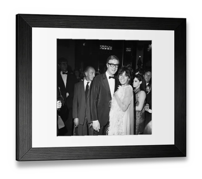 Framed Print : Michael Caine with Shirley Bassey at the premiere of the film Hurry Sundown at the Plaza