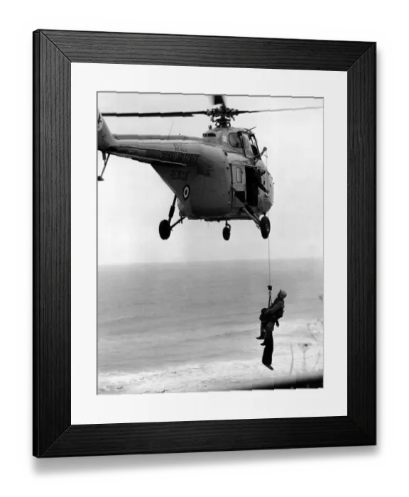 Framed Print : A RAF search and rescue Westland Whirlwind helicopter from RAF Boulmer practises air sea
