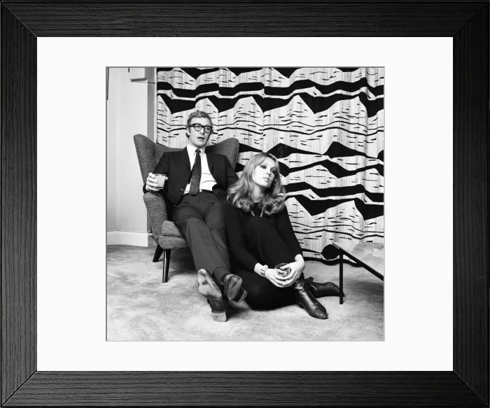 Framed Print : Actor Michael Caine pictured with French actress Miss Elizabeth Ercy in the flat of