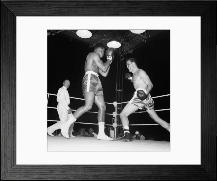 Framed Print : Action during the non-title heavyweight fight between American Cassius Clay