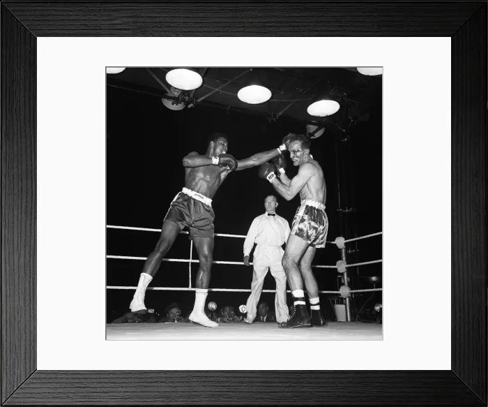 Framed Print : Action during the non-title heavyweight fight between American Cassius Clay Framed Print : Action during the non-title heavyweight fight between American Cassius Clay