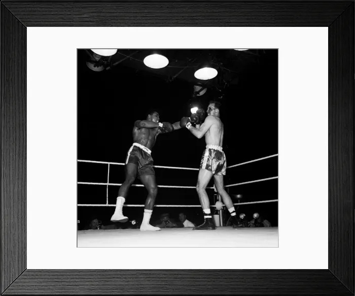 Framed Print : Action during the non-title heavyweight fight between American Cassius Clay