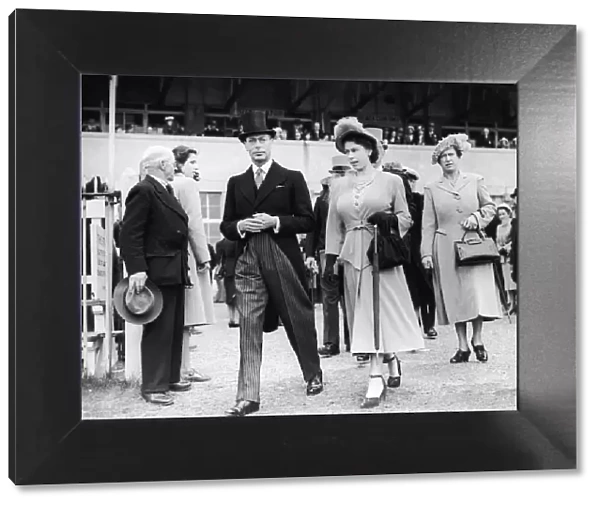 Princess Elizabeth pictuerd with her father King George VI leaving the Royal Box for