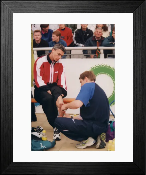 Framed Print : Athlete Jonathan Edwards Jonathan Edwards has his ankle strapped by a doctor Framed Print : Athlete Jonathan Edwards Jonathan Edwards has his ankle strapped by a doctor