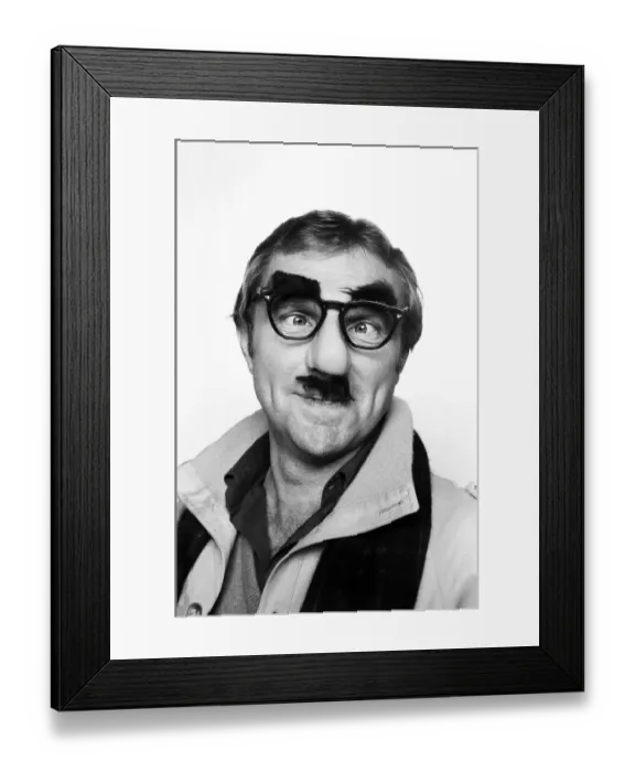 Framed Print : Bobby Moore wearing Colonel Blimp mask photographed in the Daily Mirror studio Framed Print : Bobby Moore wearing Colonel Blimp mask photographed in the Daily Mirror studio