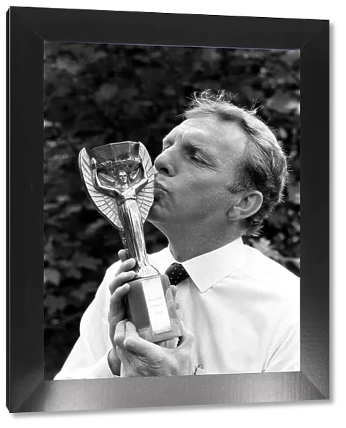 Bobby Moore West Ham and England Footballer kisses the the old Jules Rimet World Cup