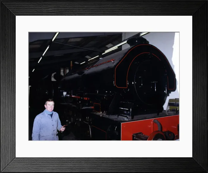 Framed Print : Keith McNulty, Hon. Treasurer with a Bagnall 0-6-0 locomotive built in 1950 at the George