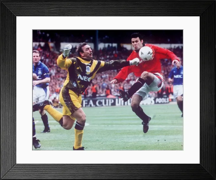 Framed Print : Neville Southall Football goalkeeper for Everton FC bending down to pick up the football Framed Print : Neville Southall Football goalkeeper for Everton FC bending down to pick up the football