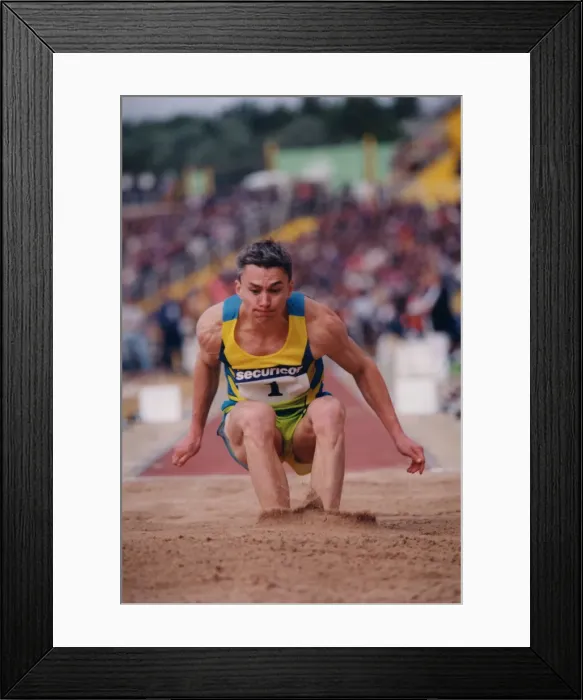 Framed Print : Athlete Jonathan Edwards Jonathan Edwards in action in the Triple Jump competition