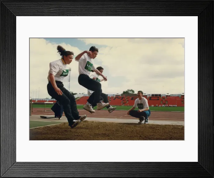 Framed Print : Athlete Jonathan Edwards Jonathan Edwards teaches triple jump techniques to Framed Print : Athlete Jonathan Edwards Jonathan Edwards teaches triple jump techniques to