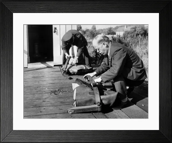 Framed Print : Post Office workers prepare the fitted pouches ready for the quick-release nets so