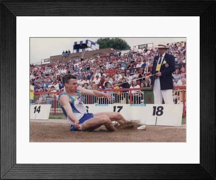 Framed Print : Athlete Jonathan Edwards Jonathan Edwards competing in the Triple Jump event during Framed Print : Athlete Jonathan Edwards Jonathan Edwards competing in the Triple Jump event during
