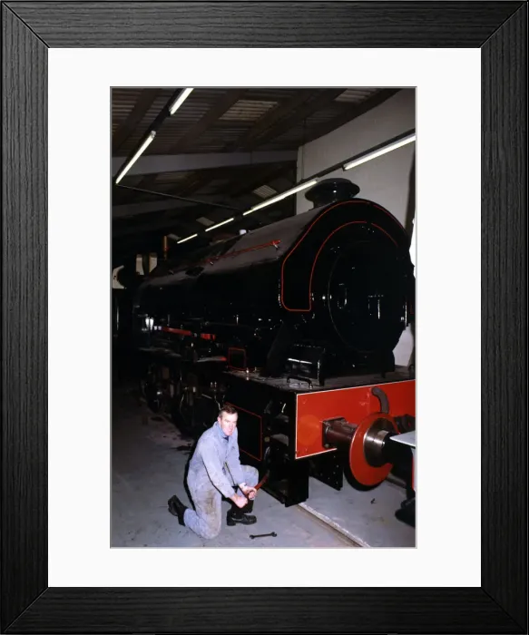 Framed Print : Keith McNulty, Hon. Treasurer with a Bagnall 0-6-0 locomotive built in 1950 at the George