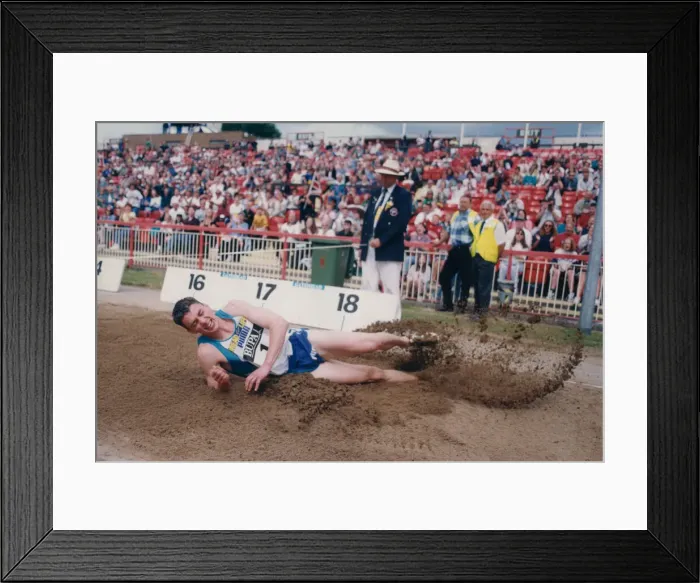 Framed Print : Athlete Jonathan Edwards Jonathan Edwards competing in the Triple Jump event during Framed Print : Athlete Jonathan Edwards Jonathan Edwards competing in the Triple Jump event during