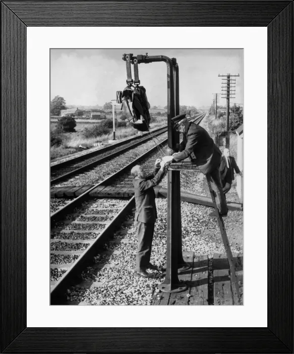 Framed Print : Post Office workers prepare the fitted pouches and hang them on special brackets Framed Print : Post Office workers prepare the fitted pouches and hang them on special brackets