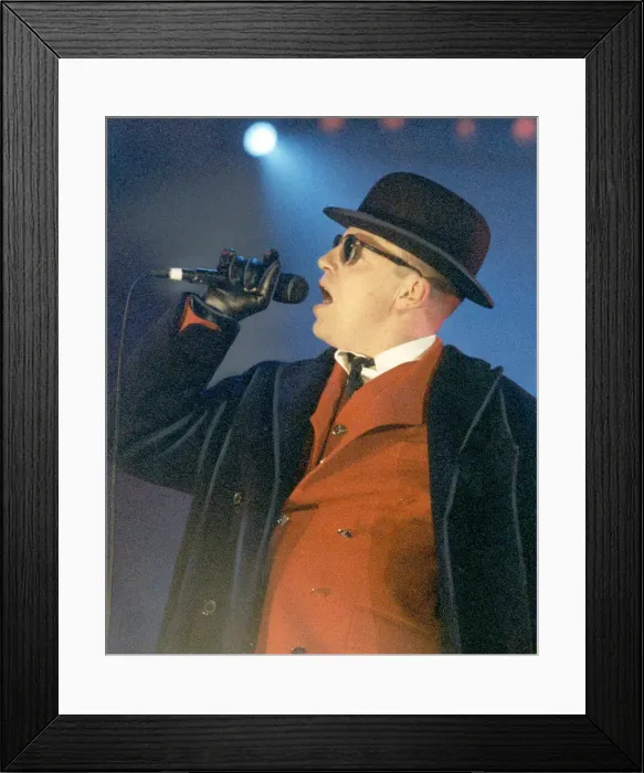Framed Print : Ska group Madness performing at GMex in Manchester. Pictured is lead singer Suggs Framed Print : Ska group Madness performing at GMex in Manchester. Pictured is lead singer Suggs