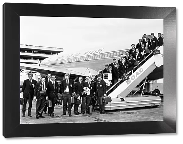 The British Lions rugby union team pose on the steps of their plane before leaving for