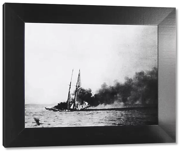 A schooner set on fire by the crew of a German U-Boat. Circa September 1918